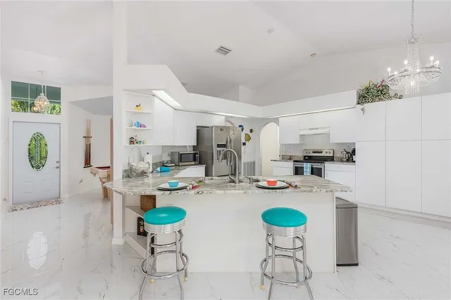 a dining room with furniture and window