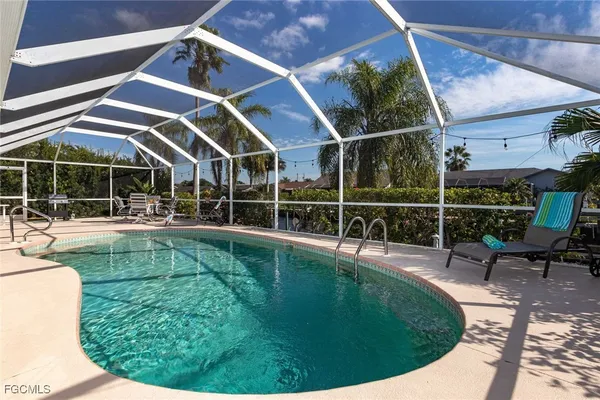 a view of a swimming pool with a patio