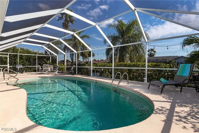a view of a swimming pool with a patio