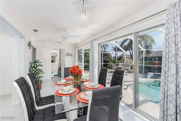 a room with pool table and windows