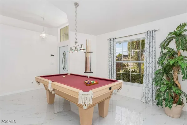 a bedroom with bed and window