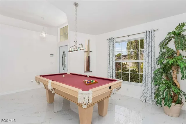 a bedroom with bed and window