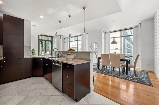 a kitchen with a kitchen island wooden cabinets and counter space