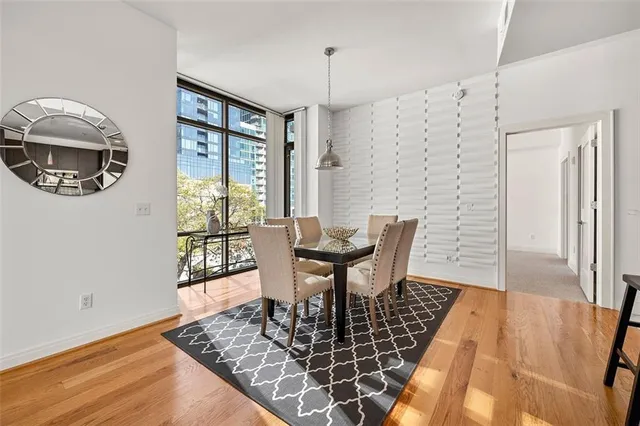 a view of a dining room with furniture and wooden floor