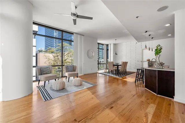 a view of a dining room with furniture window and wooden floor