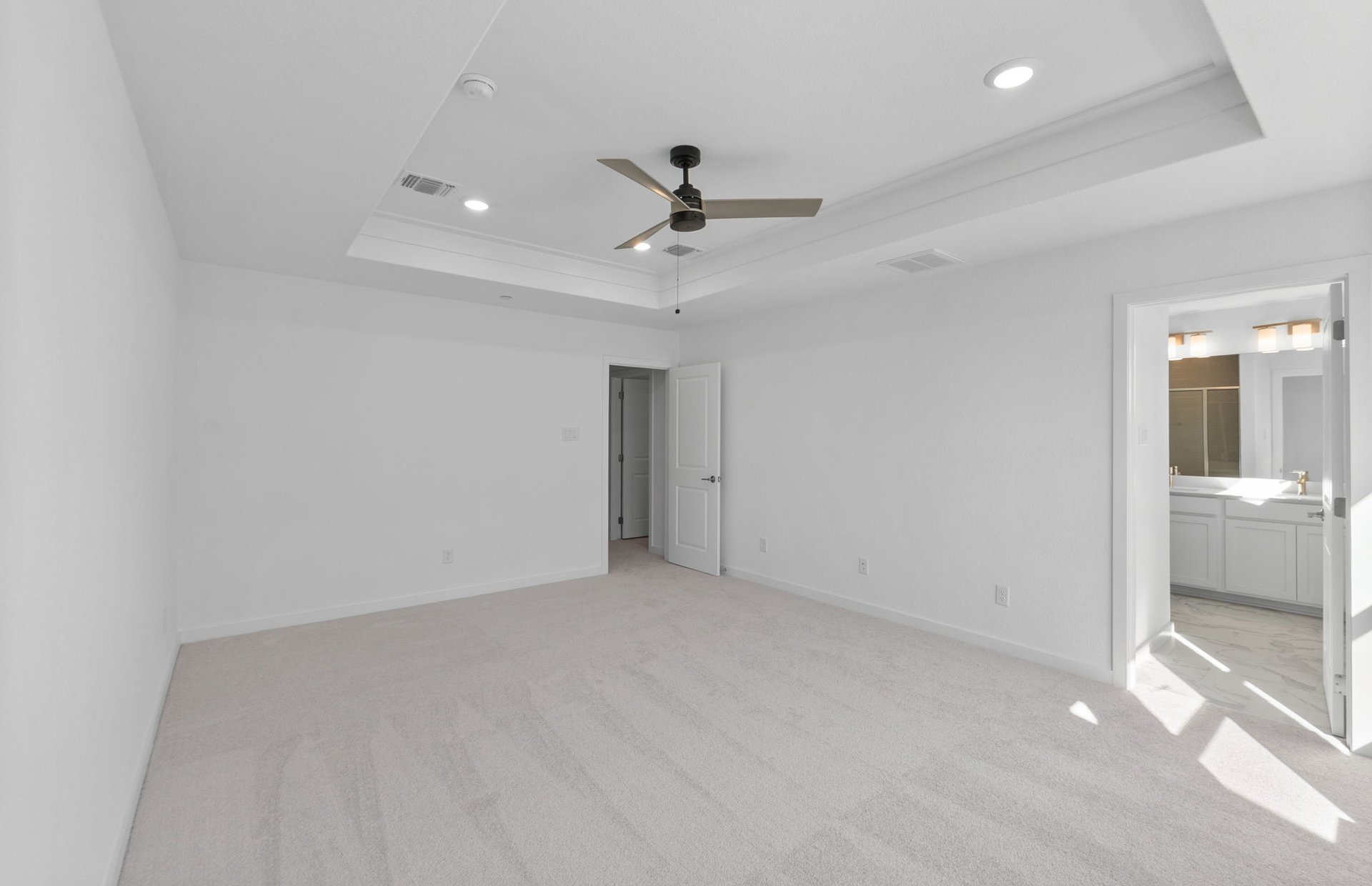 1280 East Main Street, Unit 602 Round Rock, TX 78664 - Photo 13 of 22 an empty room with a ceiling fan and windows