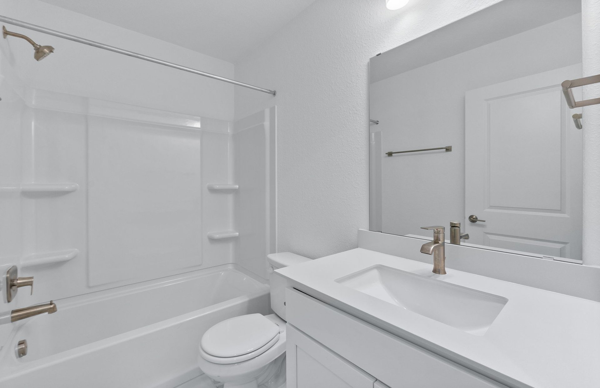1280 East Main Street, Unit 602 Round Rock, TX 78664 - Photo 15 of 22 a bathroom with a sink a toilet and a bathtub