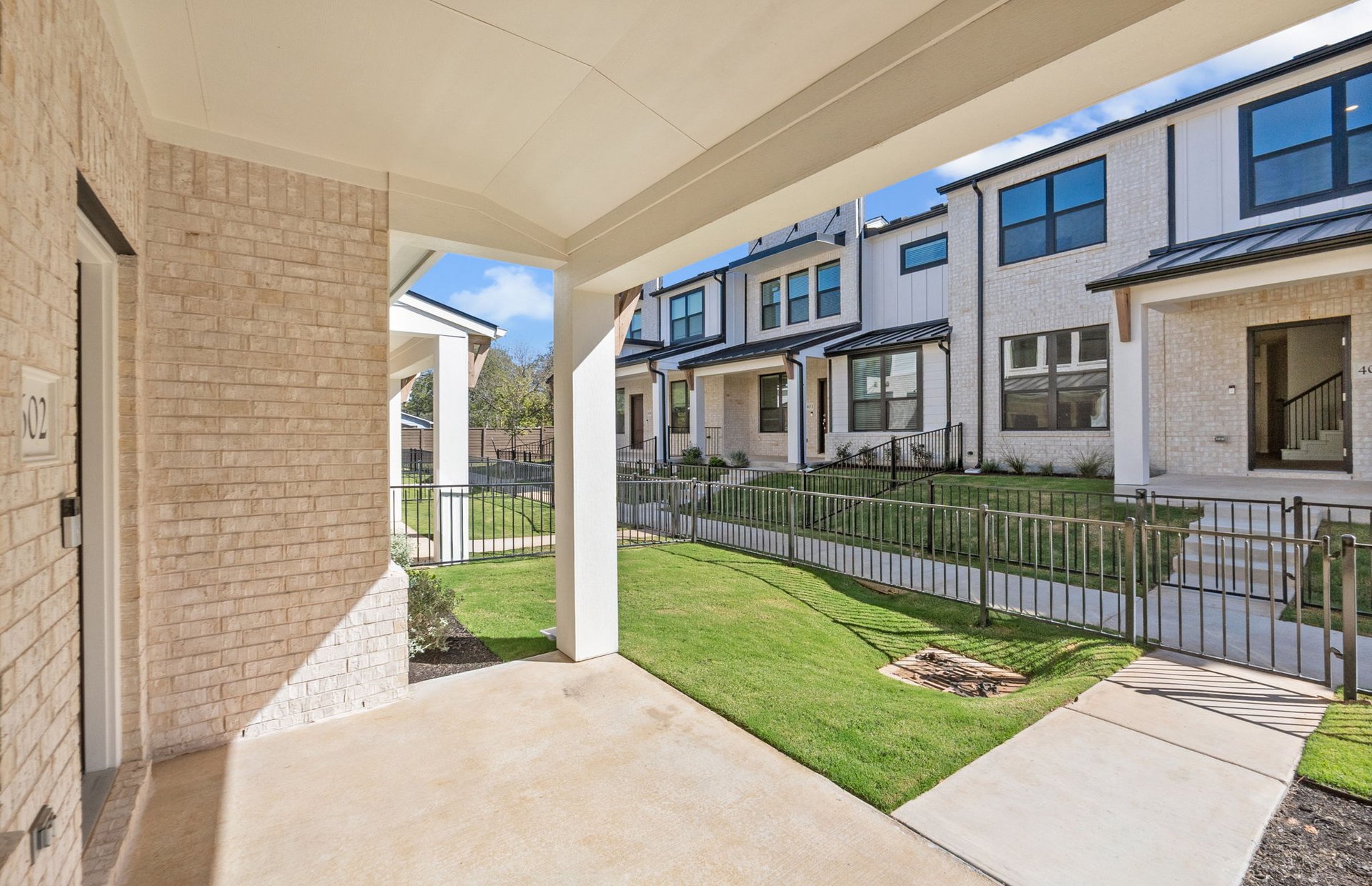 1280 East Main Street, Unit 602 Round Rock, TX 78664 - Photo 4 of 22 a view of a house with a yard in a patio