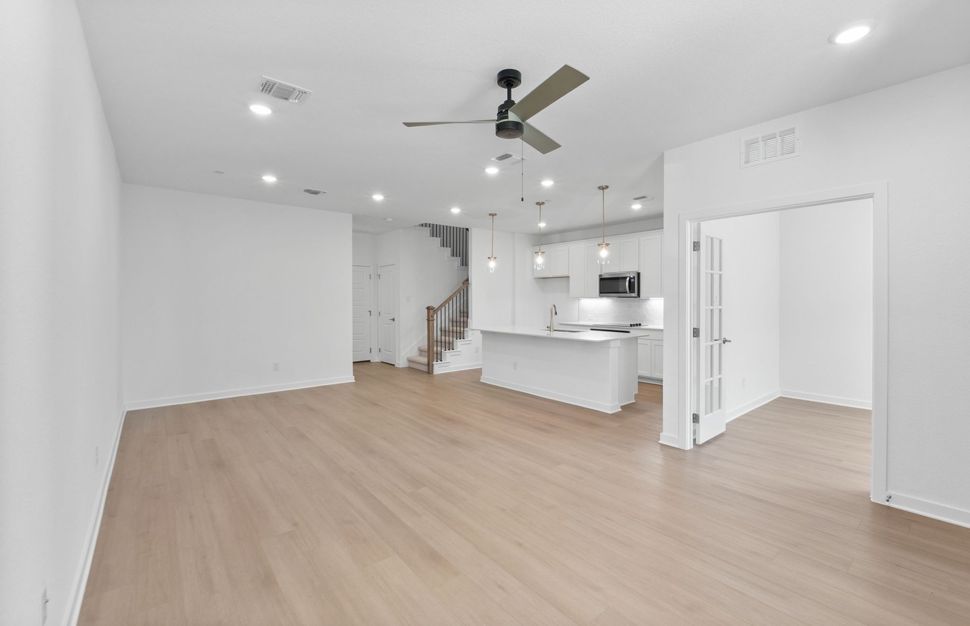 1280 East Main Street, Unit 602 Round Rock, TX 78664 - Photo 5 of 22 a view of a kitchen with a sink and a refrigerator