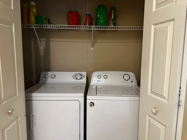 a utility room with dryer and washer