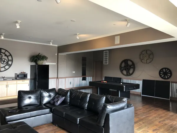 a living room with furniture and a large window