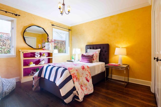 a bathroom with a sink mirror and a shower
