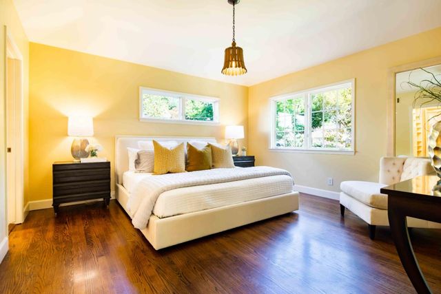 a front view of a house with a yard and a garage