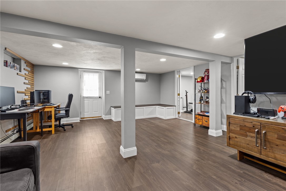 33 Fairhaven Road Cumberland, RI 02864 - Photo 23 of 36 Lower level family room - the benches provide extra storage!