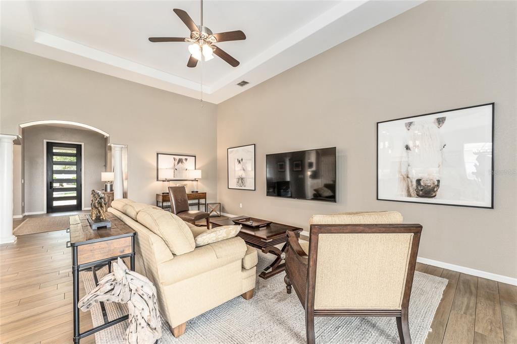 4958 Northwest 35th Ln Road Ocala, FL 34482 - Photo 21 of 66 a living room with furniture and a flat screen tv