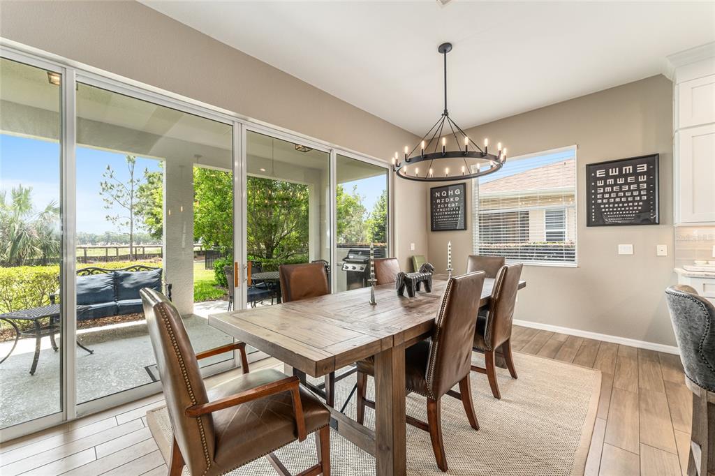 4958 Northwest 35th Ln Road Ocala, FL 34482 - Photo 24 of 66 a view of a dining room with furniture window and outside view
