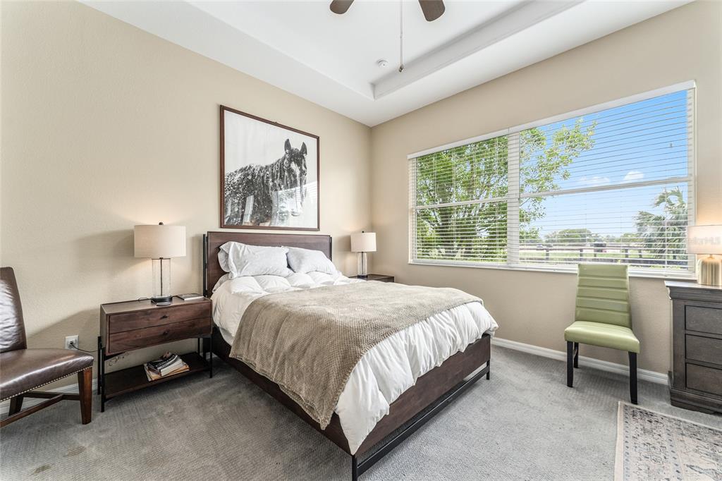 4958 Northwest 35th Ln Road Ocala, FL 34482 - Photo 35 of 66 a bedroom with a bed and a large window