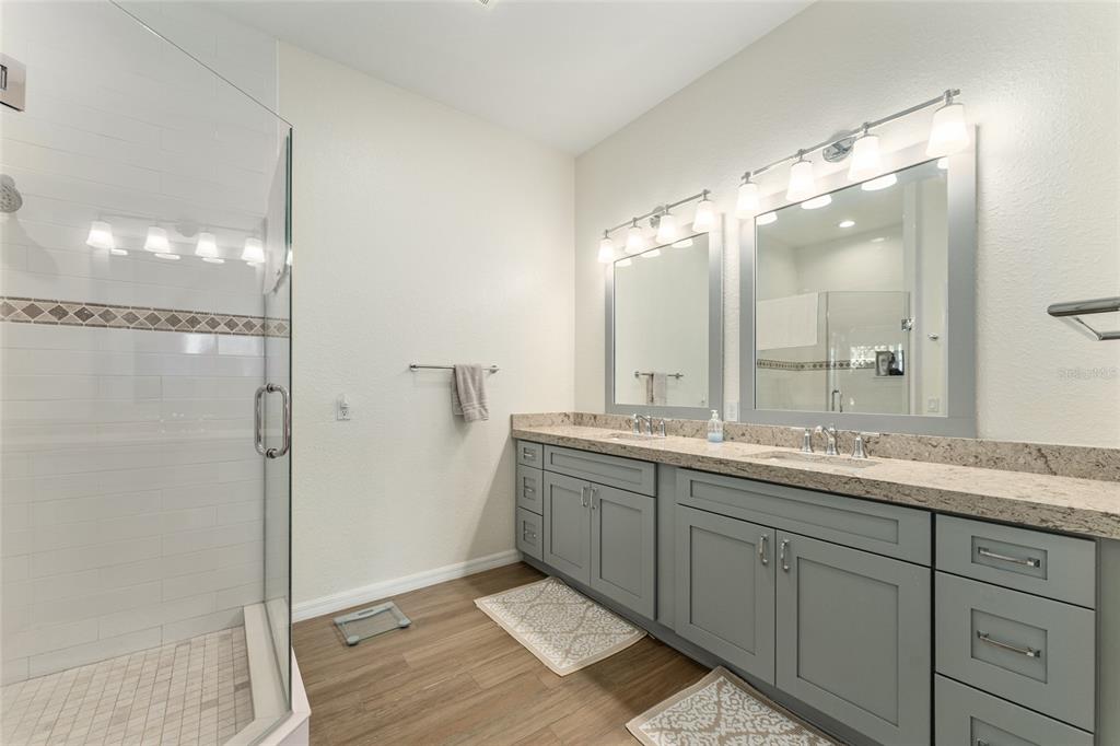 4958 Northwest 35th Ln Road Ocala, FL 34482 - Photo 37 of 66 a bathroom with a double vanity sink mirror and double