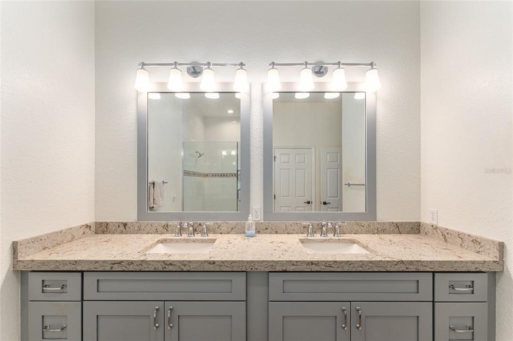 4958 Northwest 35th Ln Road Ocala, FL 34482 - Photo 38 of 66 a bathroom with a granite countertop sink double and mirror