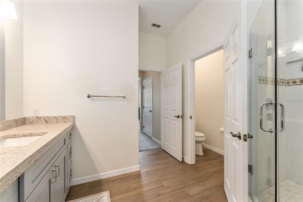 4958 Northwest 35th Ln Road Ocala, FL 34482 - Photo 42 of 66 a bathroom with a granite countertop shower mirror and a sink
