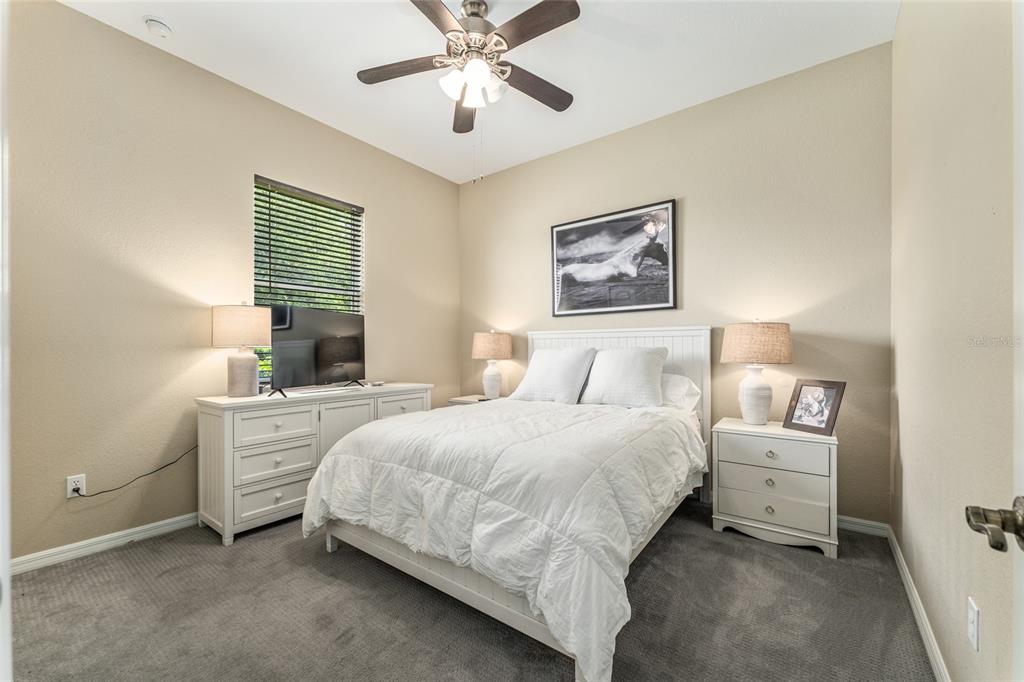 4958 Northwest 35th Ln Road Ocala, FL 34482 - Photo 43 of 66 a bedroom with a large bed and a window
