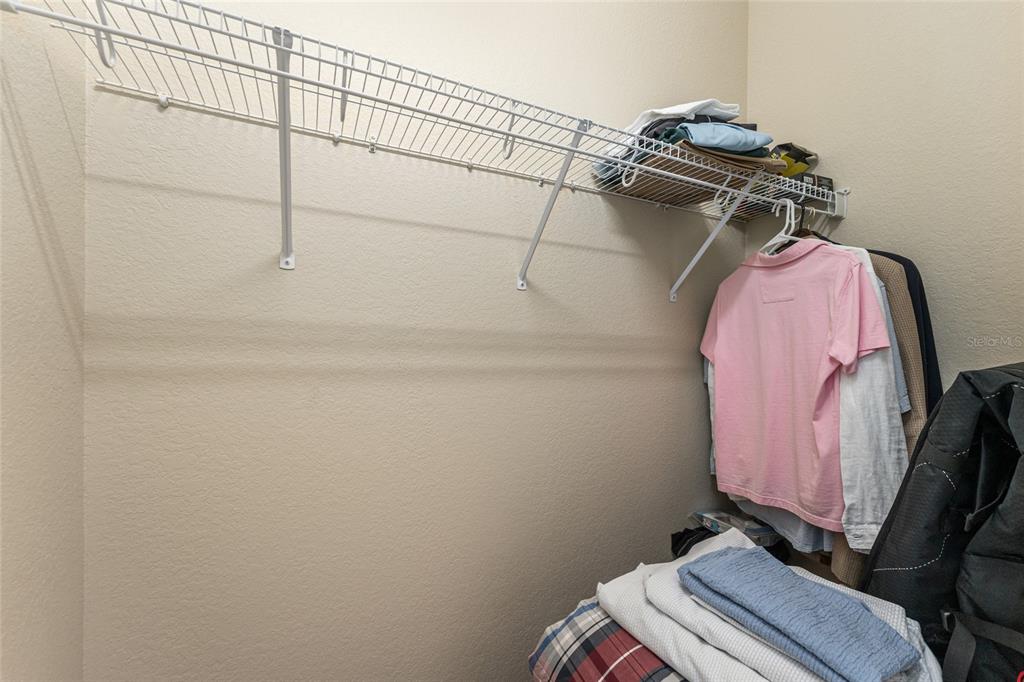4958 Northwest 35th Ln Road Ocala, FL 34482 - Photo 51 of 66 a view of walk in closet with clothes and shoes