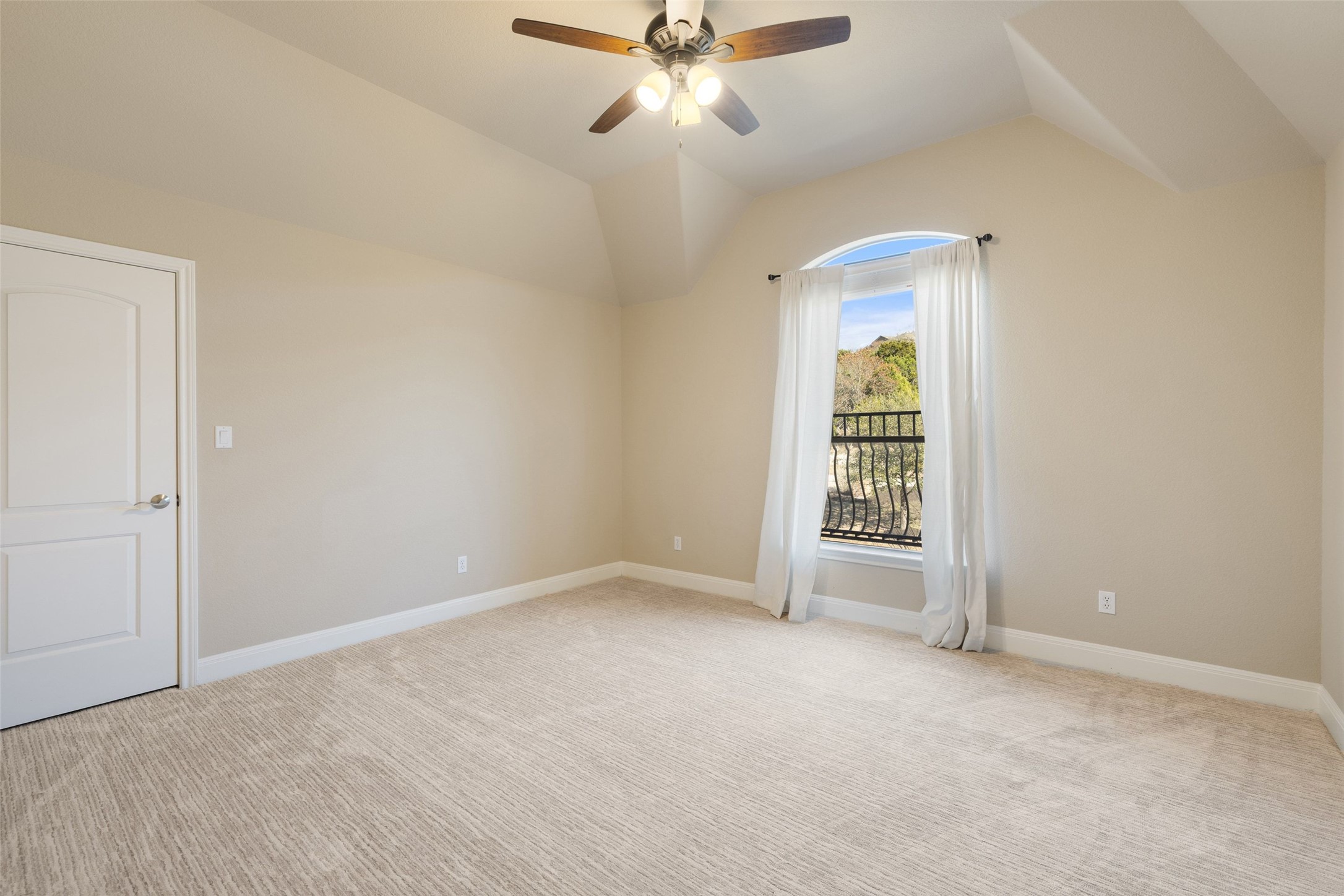 2702 Lakehurst Road Spicewood, TX 78669 - Photo 37 of 40 an empty room with windows and fan