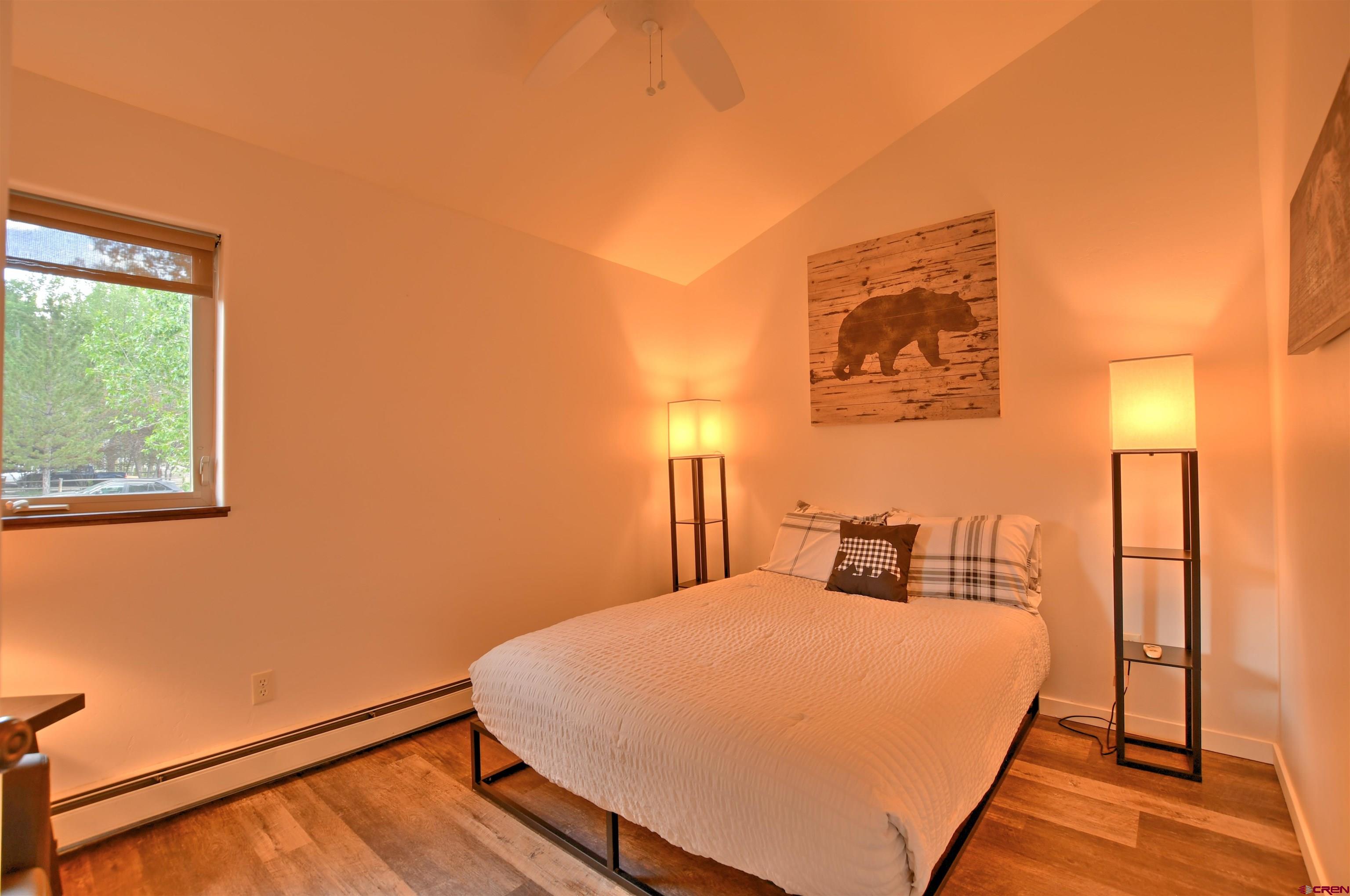 602 Chipeta Drive Ridgway, CO 81432 - Photo 22 of 41 a bedroom with a bed and a night stand