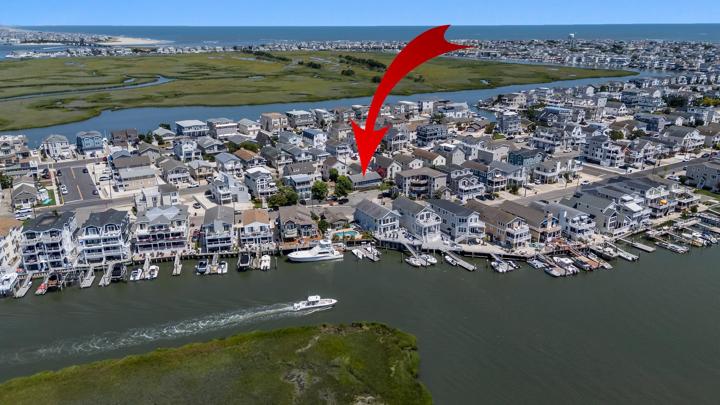 an aerial view of a house with a ocean view