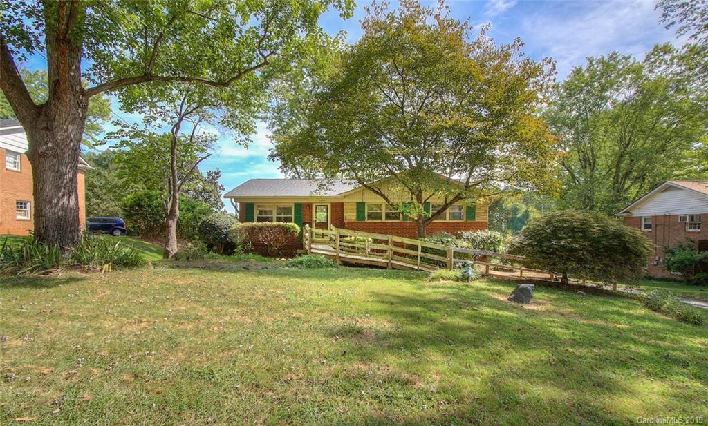 7225 Watercrest Road Charlotte, NC 28210 - Photo 2 of 32 a view of a house with a big yard and large trees