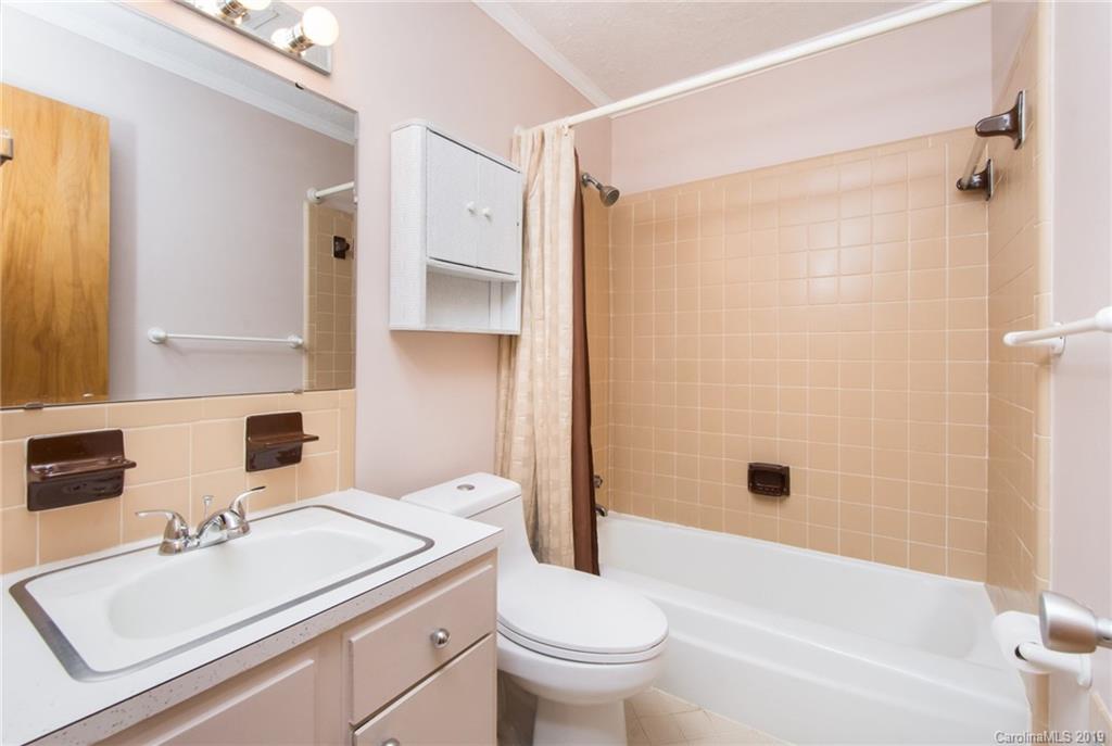 7225 Watercrest Road Charlotte, NC 28210 - Photo 12 of 32 a bathroom with a sink toilet and shower