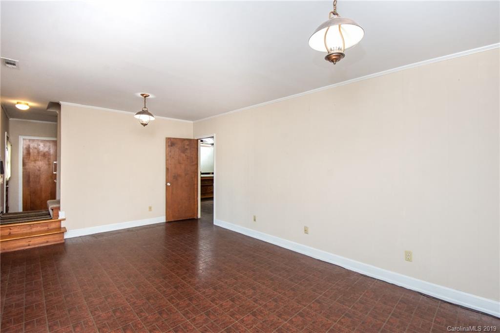 7225 Watercrest Road Charlotte, NC 28210 - Photo 20 of 32 an empty room with wooden floor and windows