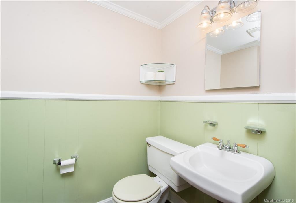 7225 Watercrest Road Charlotte, NC 28210 - Photo 21 of 32 a bathroom with a sink a toilet and mirror