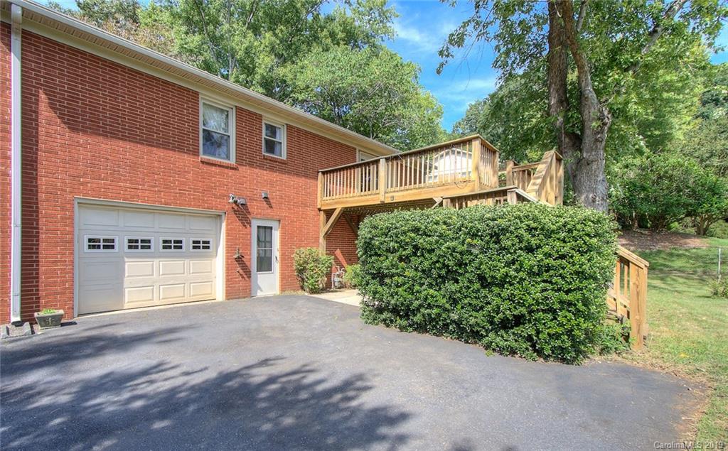 7225 Watercrest Road Charlotte, NC 28210 - Photo 24 of 32 a front view of a house with a yard and garage
