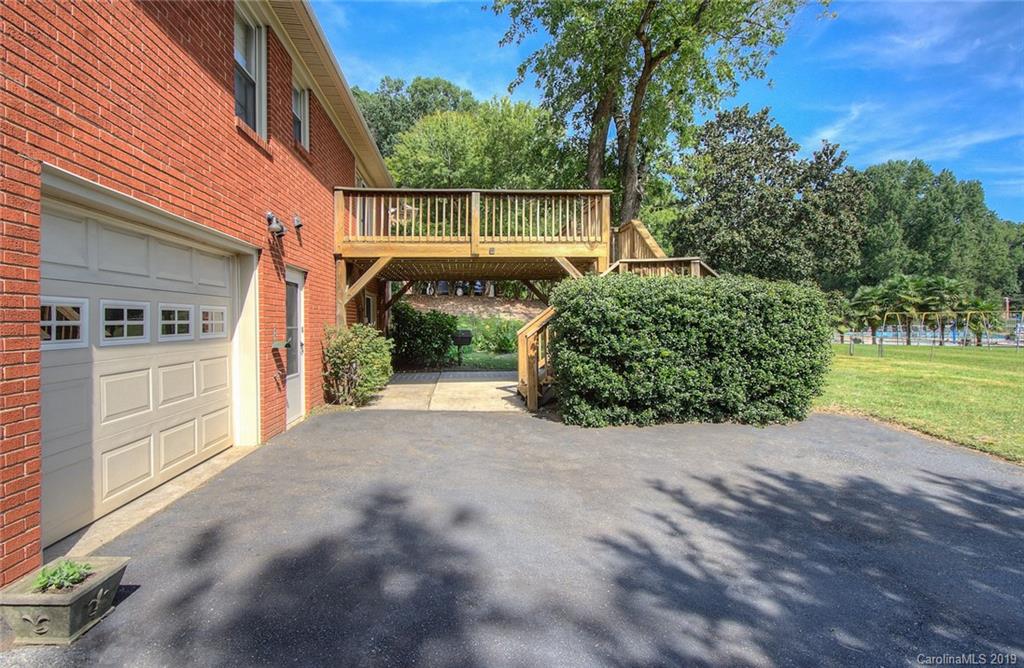 7225 Watercrest Road Charlotte, NC 28210 - Photo 25 of 32 a front view of a house with a yard