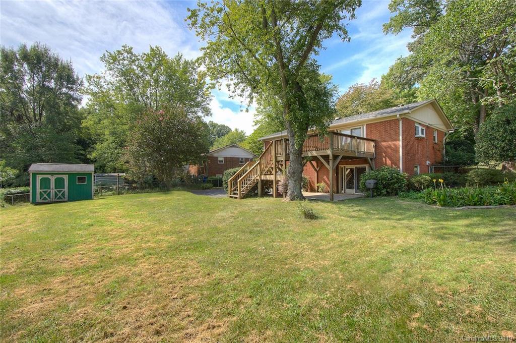 7225 Watercrest Road Charlotte, NC 28210 - Photo 27 of 32 a view of a house with a yard and tree