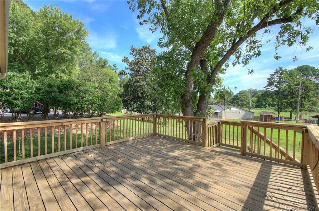 7225 Watercrest Road Charlotte, NC 28210 - Photo 28 of 32 a view of balcony with wooden floor and fence