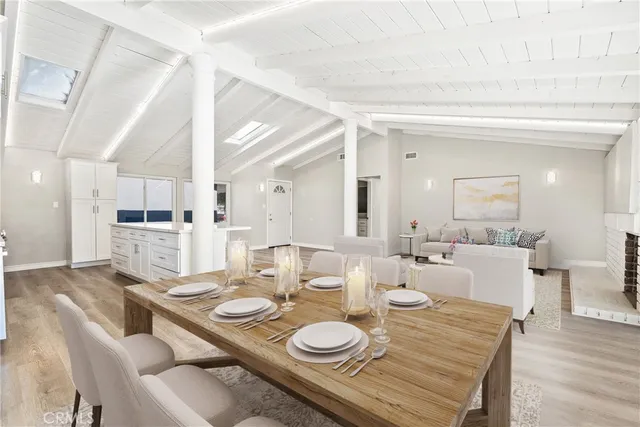 a dining room with furniture and wooden floor