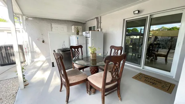 a view of a dining room with furniture window and outside view