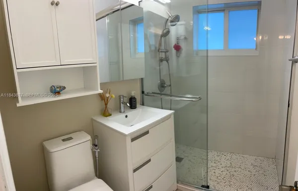 a kitchen with stainless steel appliances a refrigerator and cabinets