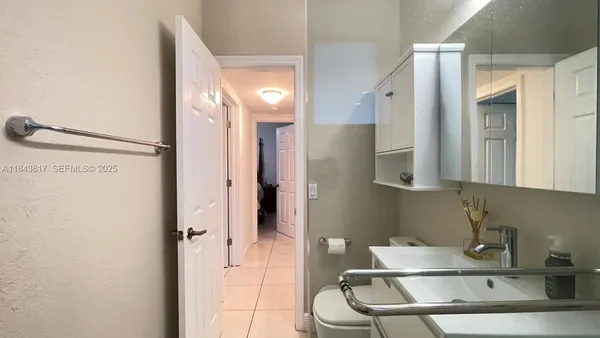 a bathroom with a sink and mirror