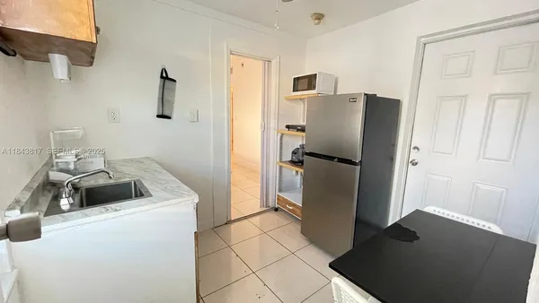 a bathroom with a sink and mirror