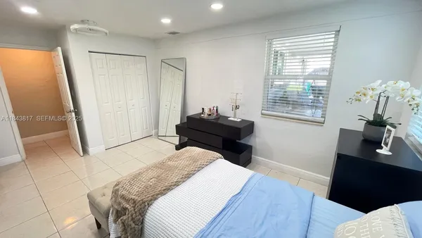 a view of a bathroom with sink and mirror