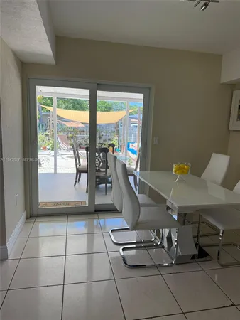 a view of an outdoor dining space with furniture