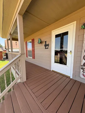 a view of deck with wooden floor and fence