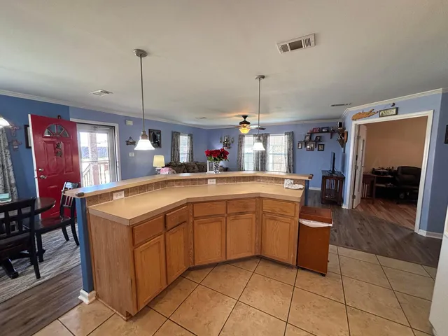 a kitchen with stainless steel appliances granite countertop a sink and cabinets