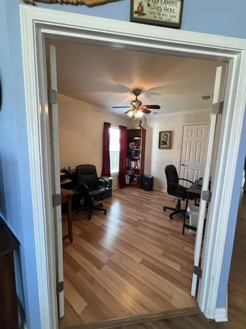 a view of living room with furniture and a chandelier
