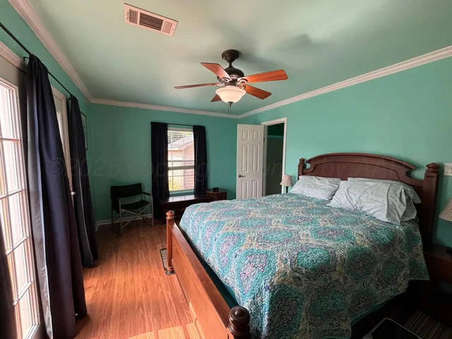 a view of a balcony with wooden floor