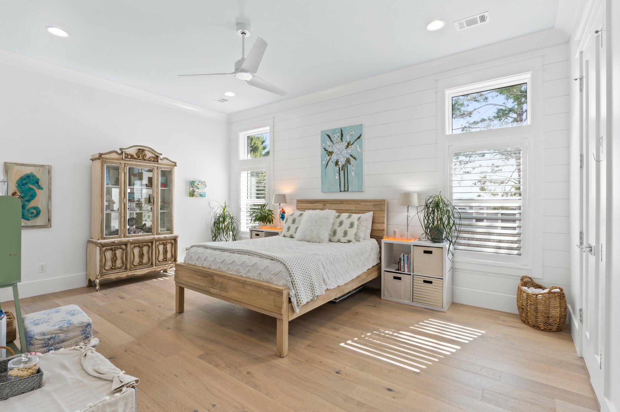 479 Ridge Road Santa Rosa Beach, FL 32459 - Photo 15 of 46 a bedroom with a bed a couch and paintings on the wall