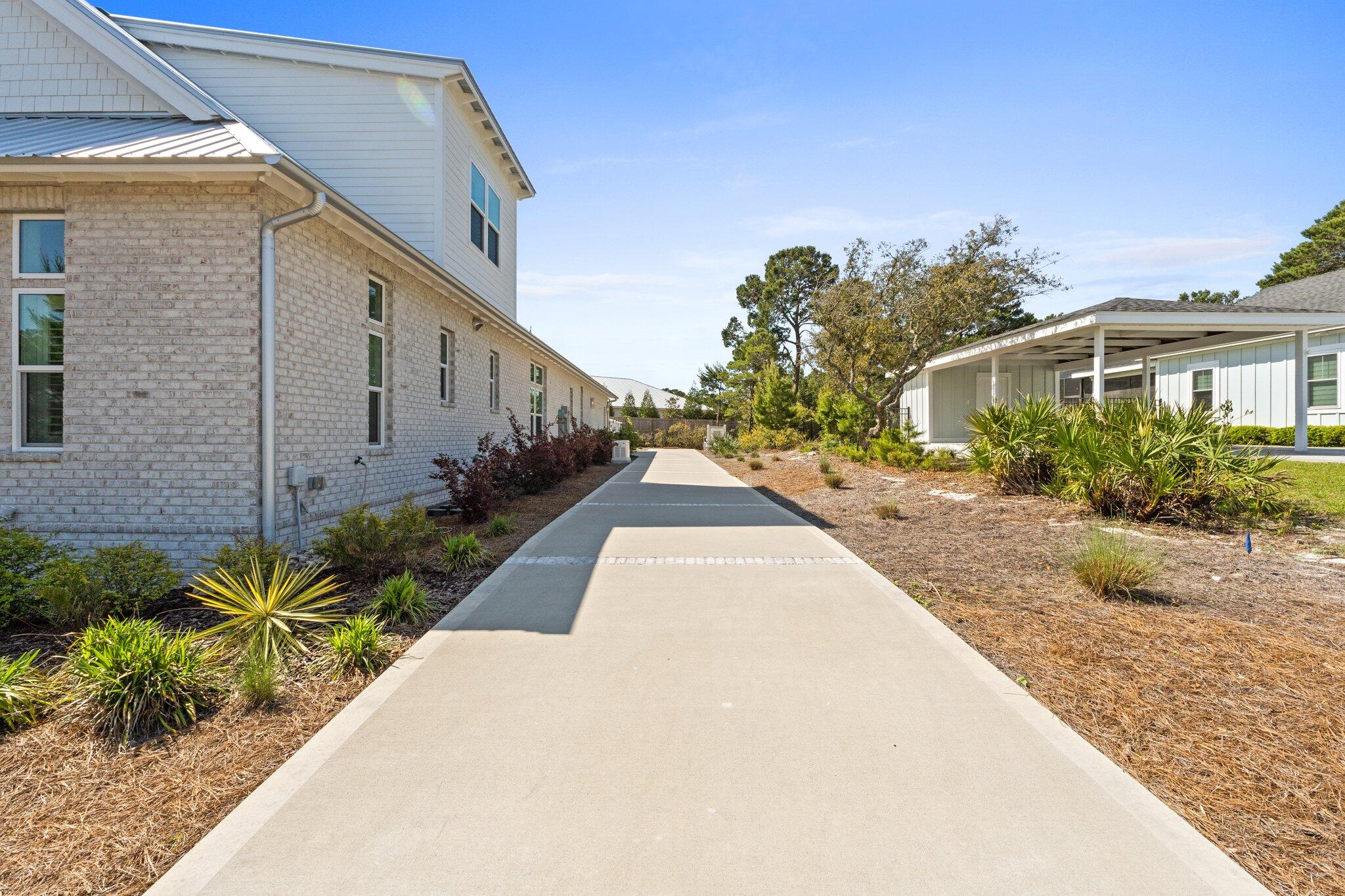 479 Ridge Road Santa Rosa Beach, FL 32459 - Photo 38 of 46 a view of a backyard with potted plants